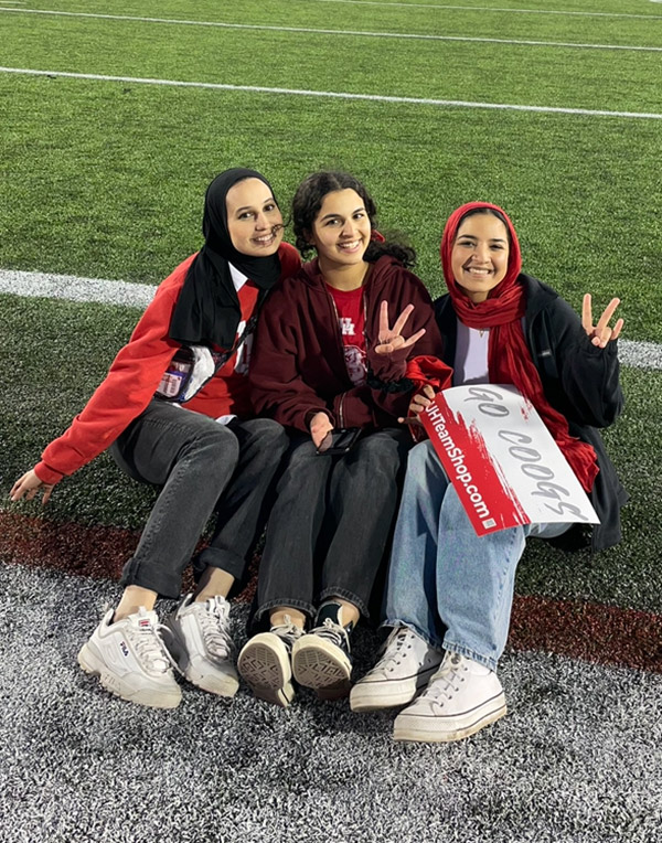 Nusayba El-Ali [center] with friends following a game at the University of Houston.