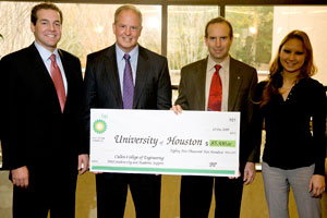 UH Cullen College of Engineering alumni Gabriel Cuadra (1988 BSChE) and Lizzie Nguyen (2006 BSChE) present Dean Joseph Tedesco and Russell Dunlavy, director of development, a check for $85,500 to support the college's Wind Energy Undergraduate Experiment as well as its departments and student organizations.