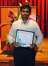 Taraka Ravi Shankar Mullapudi holds the three awards he received at the 24th Annual Campus Leaders Reception and Awards Ceremony April 27. Contributed Photo.