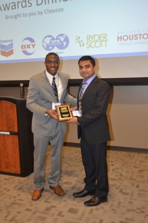 Rahul Pandey (right) receives third place in SPE Gulf Coast Regional Paper Contest