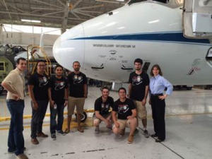 Dr. Bonnie Dunbar, faculty mentor, standing withTeam NEO before their flight in zero gravity.