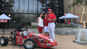 Joseph Tedesco (right), Dean of the Cullen College, poses with his wife Sue (middle) and Nayeli Martinez, a member of the UH Society of Automotive Engineers