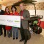 BP's Gerald Balboa, Elizabeth Nguyen (2006 BSChE) and Gabriel Cuadra (1988 BSChE) present UH President Renu Khator with a $300,000 check and an environmentally friendly solar utility vehicle. Photo by Tom Shea.