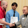 Engineering seniors John Hemmick and Osaid Shamsi receive a first place award in the Region 5 IEEE Technical, Professional and Student Conference regional circuit design competition. Photo by Tom Shea.