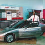 Kaushik Rajashekara with the first GM electric car, the EV1, in 1995.
