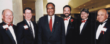 Charles Beyer, Dave Shattuck, Houston Mayor Lee Brown, Michael Lacy, David Higgins, and Ravi Singhania. Photo by Phil Busby.