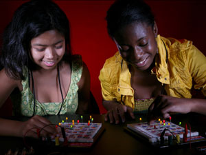 GRADE campers participate in a game of circuit Bingo, one of many activities designed to open young girls minds to science and engineering, during the final week of the UH camp. Photo by Thomas Shea.