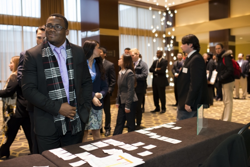 E-Week Reception Attendees Check in at the UH Hilton