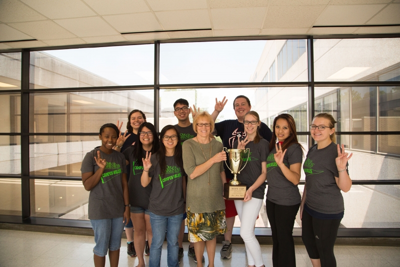 Zerda presents IEEE with Hope Cup trophy.