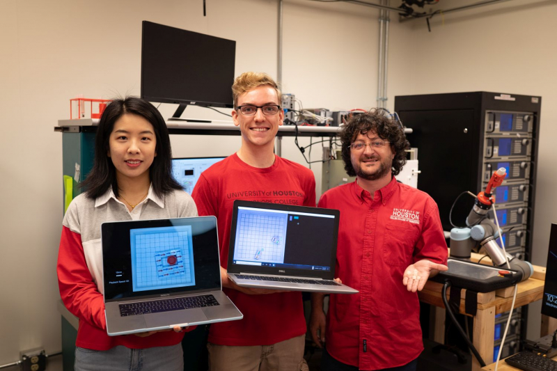 Yitong Lu, Ph.D. student, Conlan Taylor, undergraduate student, and Julien Leclerc, Research Associate, demonstrated magnetic manipulation controls in Associate Professor Aaron Becker’s lab in September 2021.