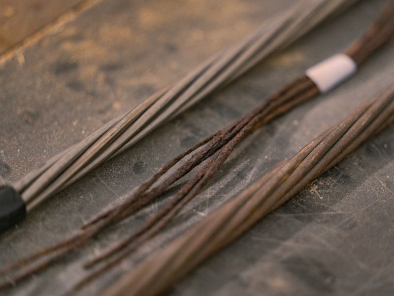 Examples of steel (left), corroded steel (center) and regular steel (right) strands.  