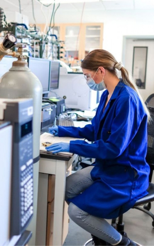 Hall works on an experiment in the lab at the University of Houston.