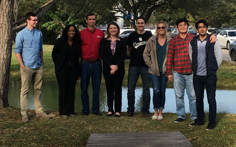 Melanie Hazlett [center] with her research colleagues at the University of Houston, from the mid-2010s.