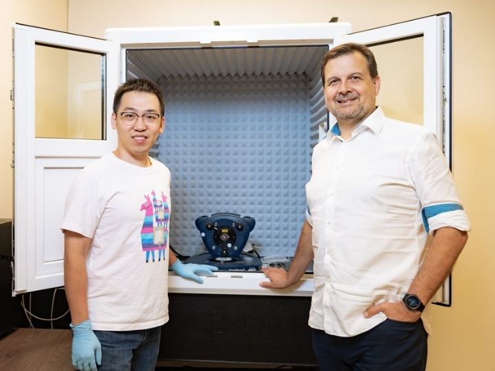 Graduate student Yuechuan (Alex) Xu, left, and Professor Peter Vekilov of the University of Houston with an atomic force microscope of the sort they used to capture the growth of amyloid beta fibrils implicated in Alzheimer’s disease.