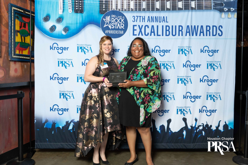 Inez Hutchinson [right], communications manager for the Communications Department of the Cullen College of Engineering, accepts one of the two gold Excalibur awards the department won from Felicia Perez, Houston chapter president of the Public Relations Society of America. 