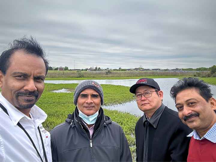 The Managing Urban Runoff project tests abilities of certain native grass species to clear pollution from coastal waters. On the study site, from left, are principal investigator Vankatesh Balan, University of Houston; Ram Ray, Prairie View A&M University; Weihang Zhu, UH; and Gururaj Neelgund, Prairie View A&M. Not pictured are researchers Xiaonan Shan, UH, and Sandeep Kumar, Old Dominion University.