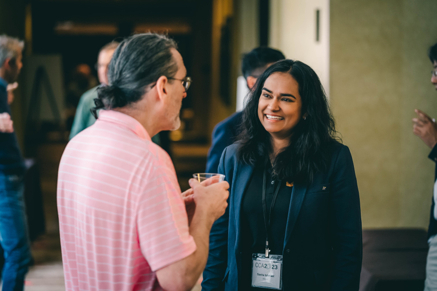 Two participants chat during CCA 2023. For more images, please check out our Flickr gallery [link provided in story].