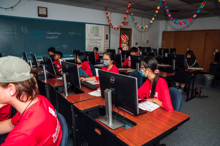 A group of middle school students practice coding during the 2023 DesignYOU! Code Camp.