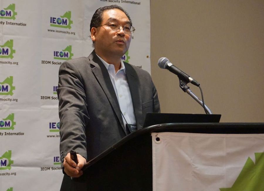Geno Lim speaking during the 8th North American Industrial Engineering & Operations Management (IEOM) Conference.