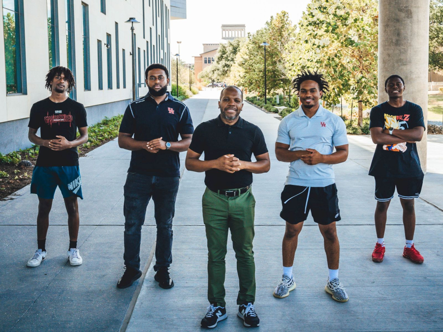 Jerrod Henderson [center], an assistant professor in the William A. Brookshire Department of Chemical and Biomolecular Engineering, is the Cullen College of Engineering's latest recipient of a National Science Foundation CAREER award. [Left to right] Jamiel Williams, Amanual Getaneh, Henderson, Ahmad McCray and Omar Sanchez.