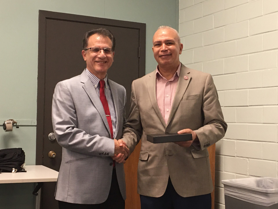 Heidar Malki, Senior Associate Dean of the Technology Division, with Medhat El Nahas, instructional professor of Mechanical Engineering Technology, the winner of this year's Non-Tenure Teaching Excellence Award.