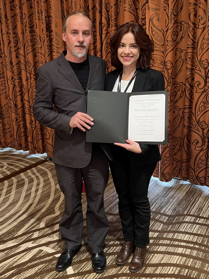 Doctoral candidate Nathaly Andrea Castaneda Quintero poses with Goran Majkic, research professor in the Mechanical Engineering Department, after winning the inaugural Poster Prize Competition at CCA 2023, the Coated Conductors for Applications International Workshop, held at UH in April. 