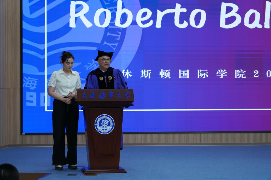 Dr. Roberto Ballarini addressing the students in English, while Institute staff member Ms. Yan Honglin (Holly) translates his words into Chinese for the graduates’ non-English speaking parents, siblings and friends.