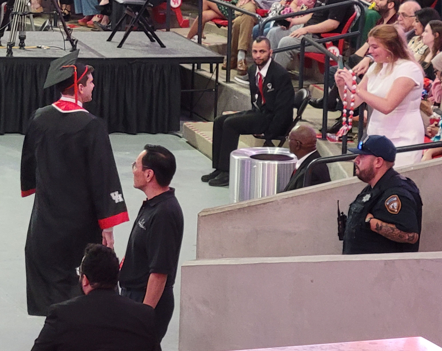 Family and loved ones chronicle graduation. 