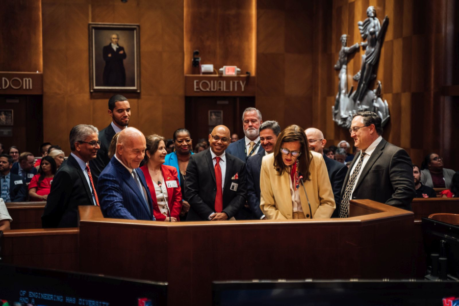 At the dais. 