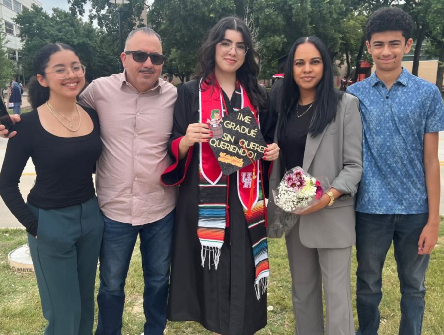 [center] Daniela Gomez, flanked by her family.