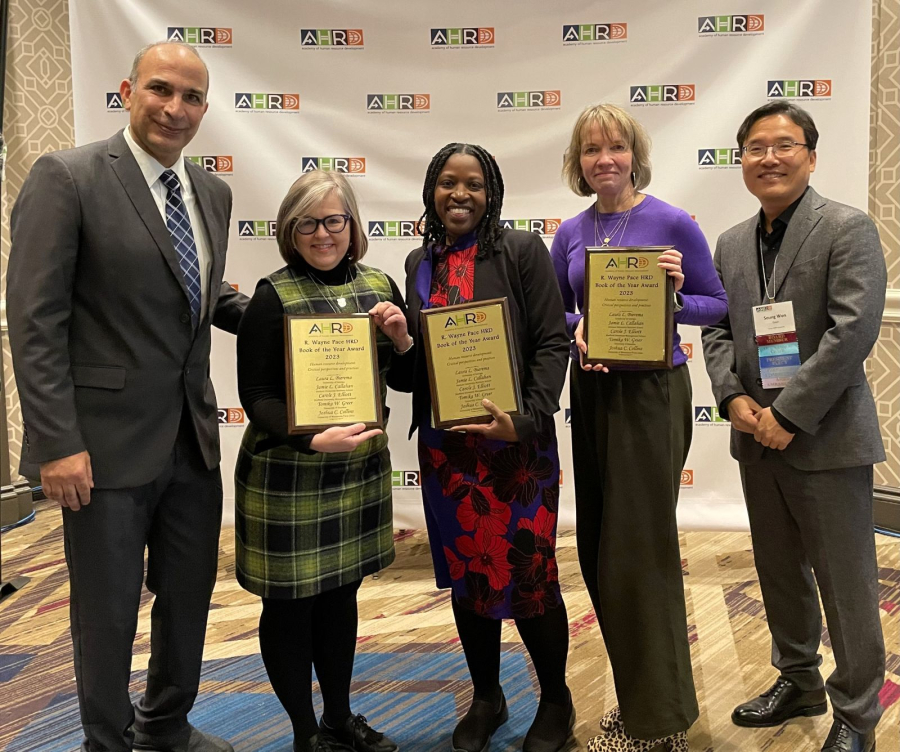 [Center] Tomika W. Greer, flanked by members of the awards committee. 