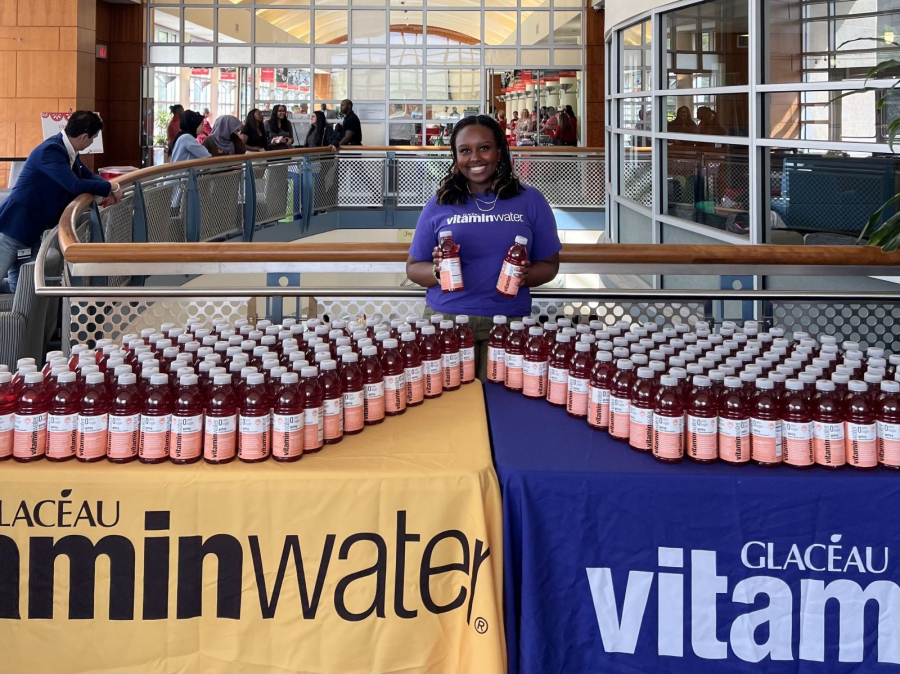 Melissa Rurangirwa at a table for Vitamin Water. 