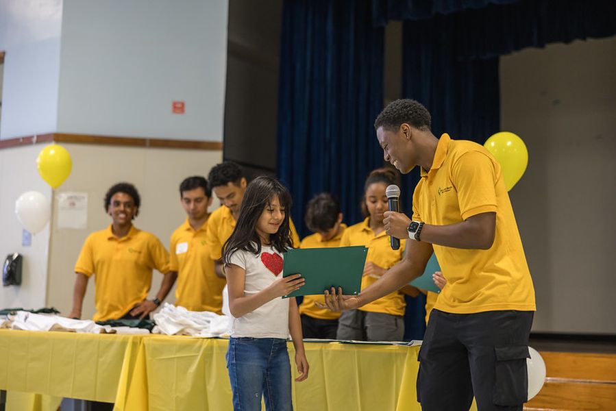 A student is honored at the St. Elmo Brady STEM Academy Science Fair.