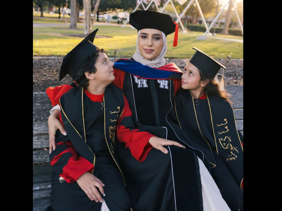 Summer Dalgamouni (center) flanked by twins Lawrence (left) and Laura. [Photo by David Dara - @daviddaraphotography.]