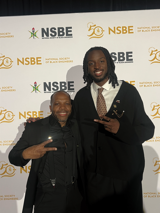 NSBE faculty advisor Jerrod Henderson and chapter president Chinonso Ezekwesili at NSBE National Conference 2025.