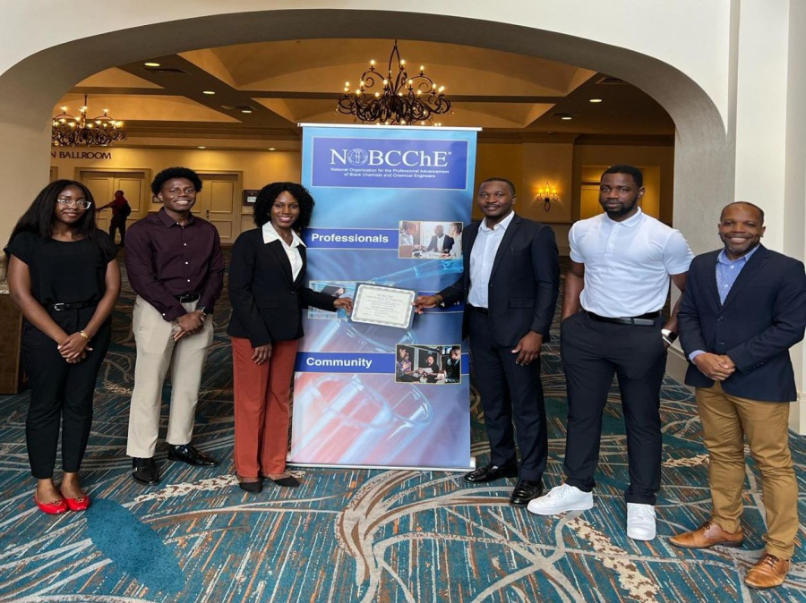 A group photo with the chapter certificate of charter at the 2024 national conference in Orlando. 