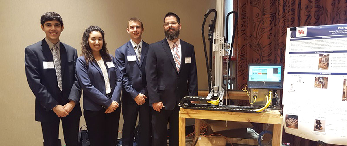 The UH Phoenix team – Andrew Advani, Sharlyn Tijerina, Jacob Frady and Joseph Pauwels – & its Planetary Ice Extractor (PIE). The team is a finalist in the NASA’s 2019 Special Edition: Moon to Mars Ice & Prospecting Challenge.