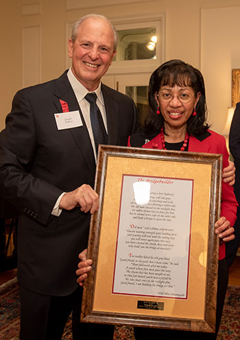 Coleman receiving her Bridgebuilder Award from Dean Tedesco