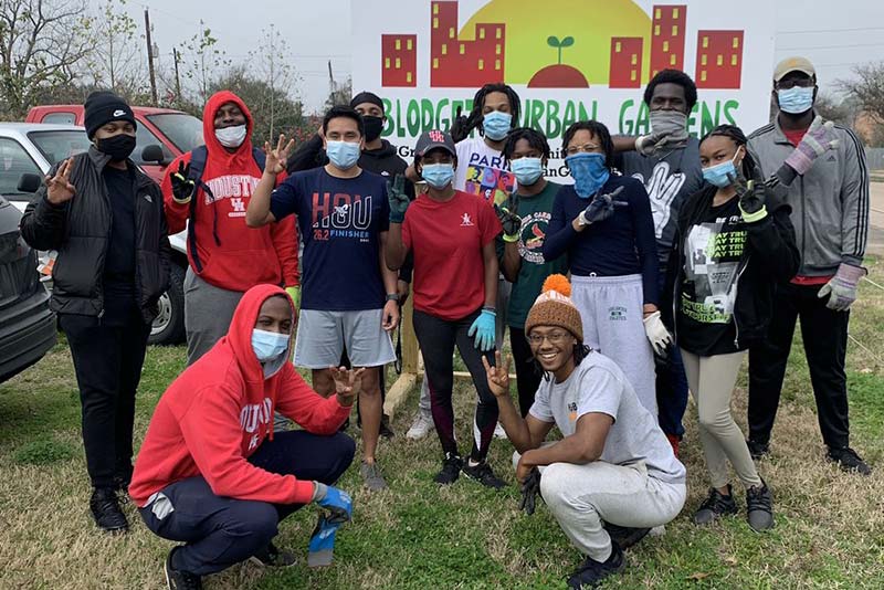 UH NSBE members volunteering at a previous community event at the Blodgett Urban Gardens.