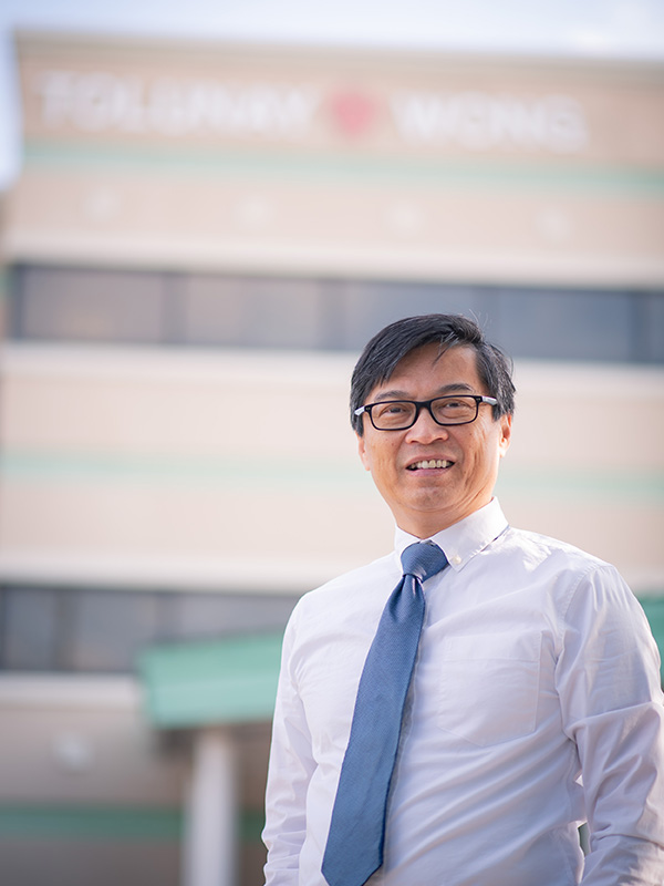 Daniel Wong pictured outside Tolunay-Wong Engineers, Inc. headquarters.