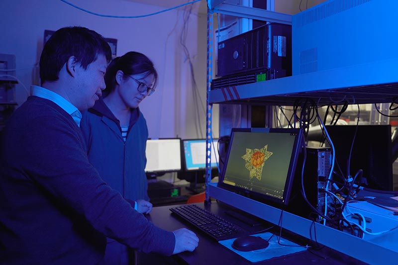 Yan Yao and research students working to develop clean energy technologies in the lab.