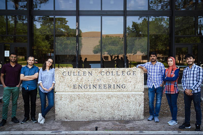 Zerze's research team takes a break for a group picture outside the Cullen College of Engineering. 