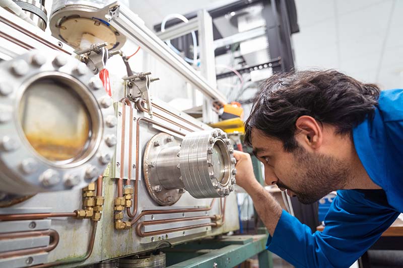 Doctoral students put STAR superconductor wires through stress tests.