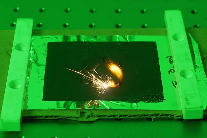 Laser cutting a solid state battery casing.