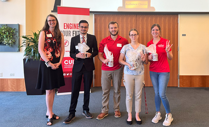 Dr. Jamison Kovach and students at the Create@UH open house session.
