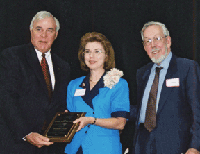 UH President Arthur K. Smith and George Magner present Shirley Mate with the 2001 George Magner Award for Excellence. 