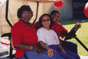 UH Cullen College of Engineering staff members Shirley Ray, Mytrang Baccam and Kim Jordan from the Department of Electrical & Computer Engineering and Angie Shortt (not pictured) from the Dean's Office participate in the Homecoming parade.