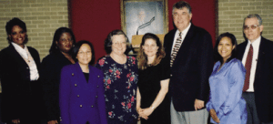 Staff who were nominated for the Dean's Meritorious Staff Award and pictured with Dean Flumerfelt include: Carolyn Duhon, Betty Garrett, Mytrang Baccam, Mary Patronella, recipient Mary Schulz, Mary Reed and John Young. Not pictured: Adele Rena.