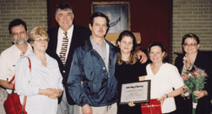 Mary's family makes a surprise appearance after she receives her award. Pictured: Her brother Ross Hanson, Jr., sister-in-law FrediAnn Hanson, Dean Flumerfelt, husband Dale, Mary and her sisters Judy Pearl and Lynda Turrentine.