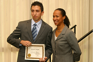 Outstanding Junior Julian Vargas receives his award from Melissa C. Henderson, chair of the Houston Engineers Week Committee, at the Texas Society of Engineering luncheon. Photo by Jeff Shaw.